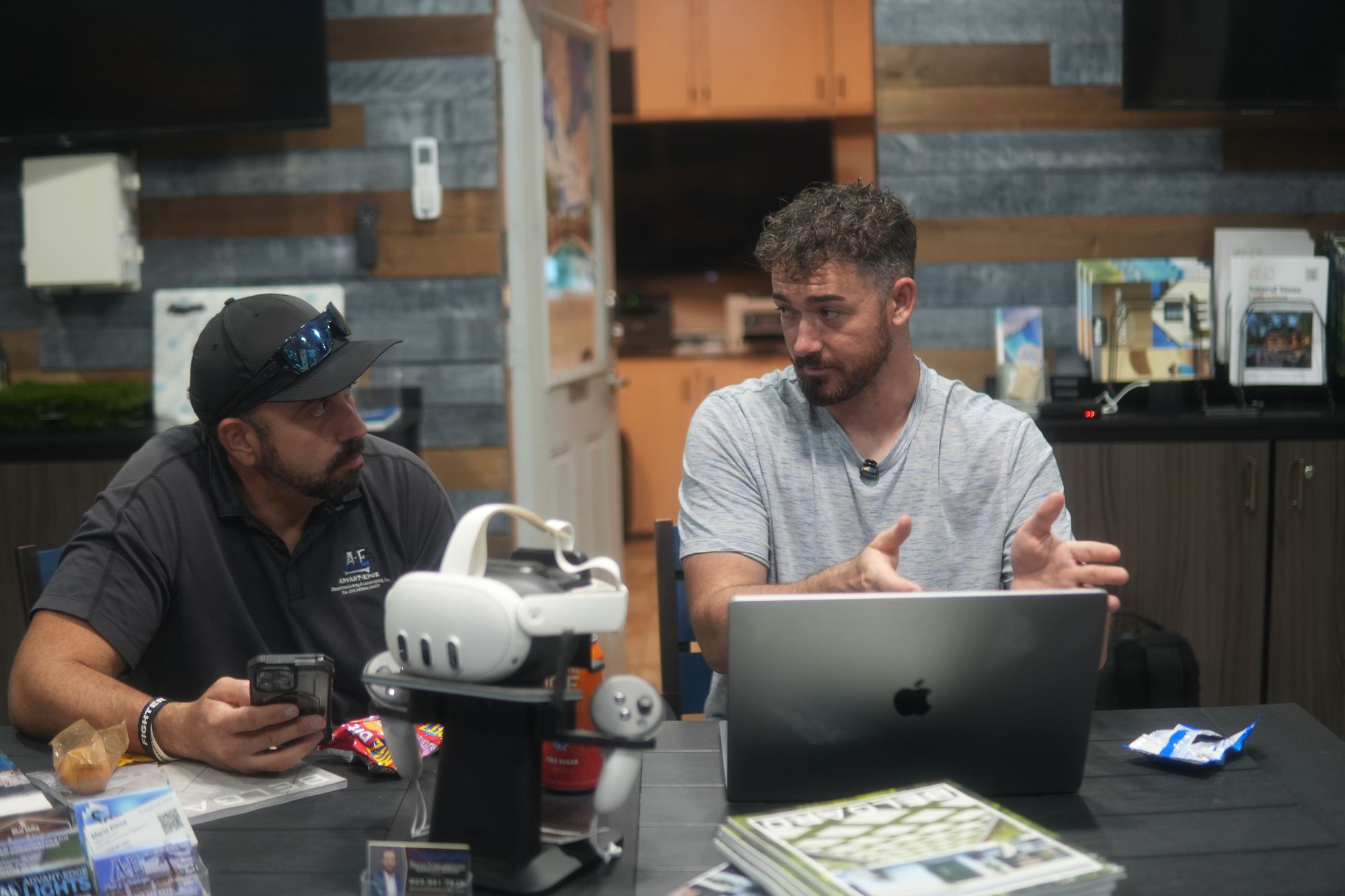 Douglas Laird at the table with a contractor