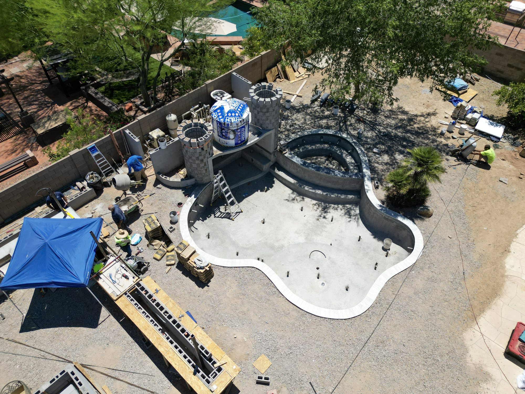 Overhead view of a custom pool and castle grotto during construction in Surprise, AZ