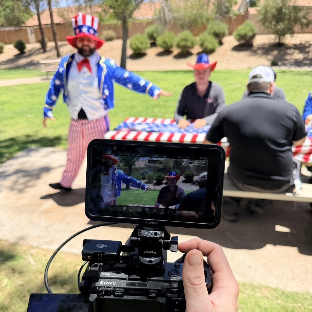 Filming a client event, framed on the camera monitor